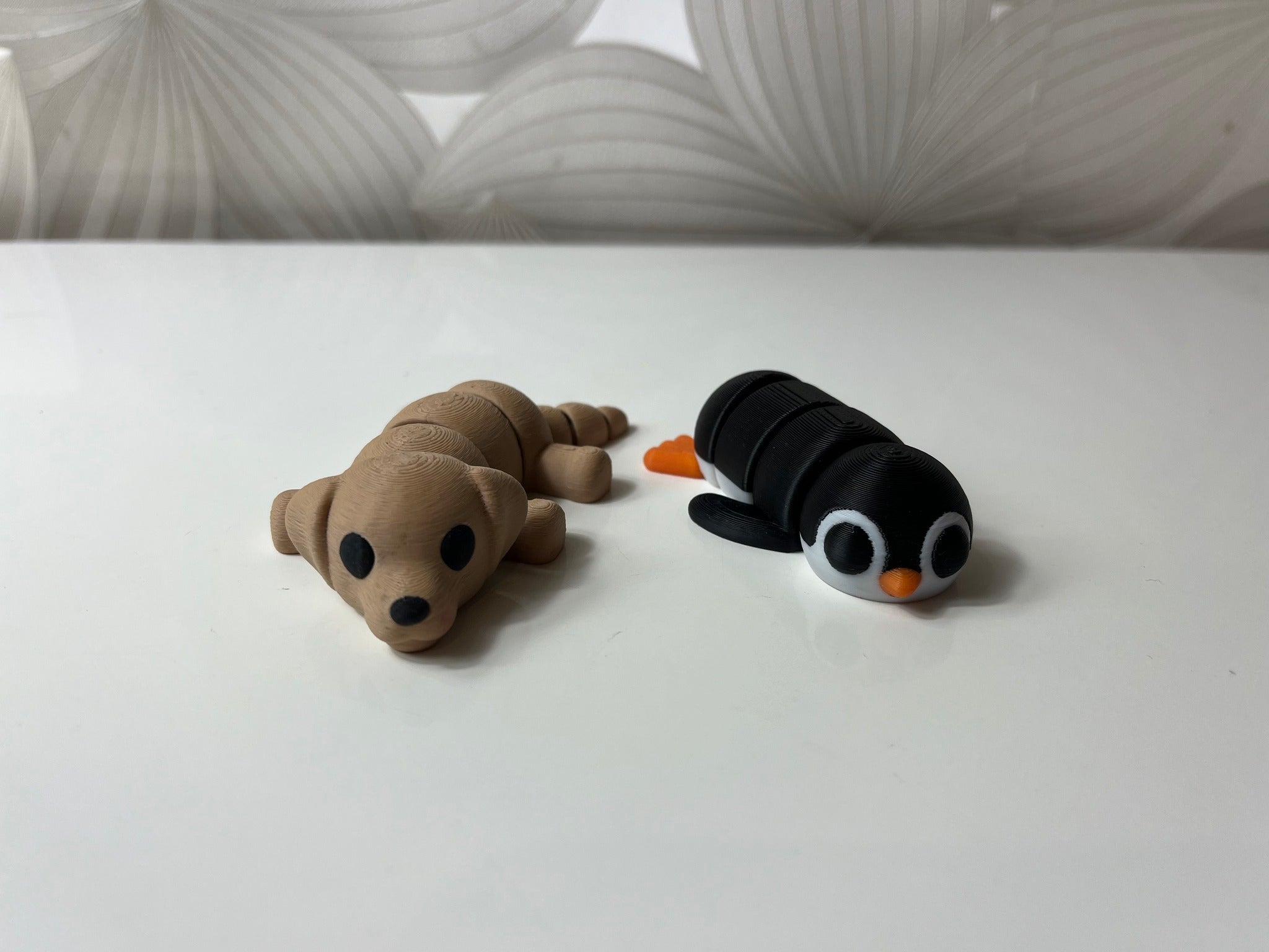 3D spausdintuvu atspausdinti šuniuko ir pingvino žaisliukai - Daiktų atokvėpis