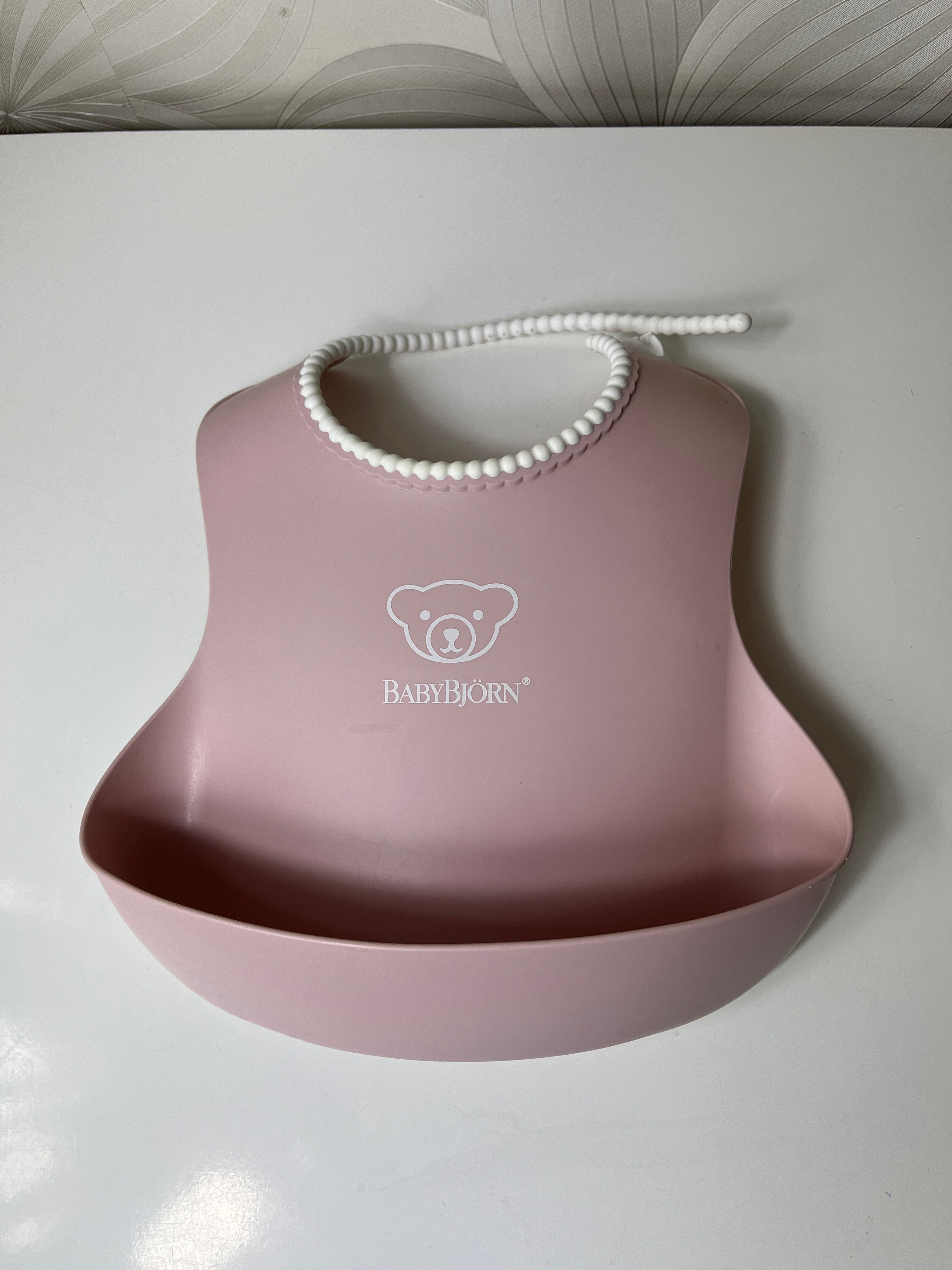 Rožinis seilinukas vaikui „Baby Bjorn“