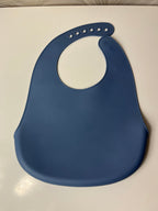 Mėlynas silikoninis seilinukas vaikui su raketomis