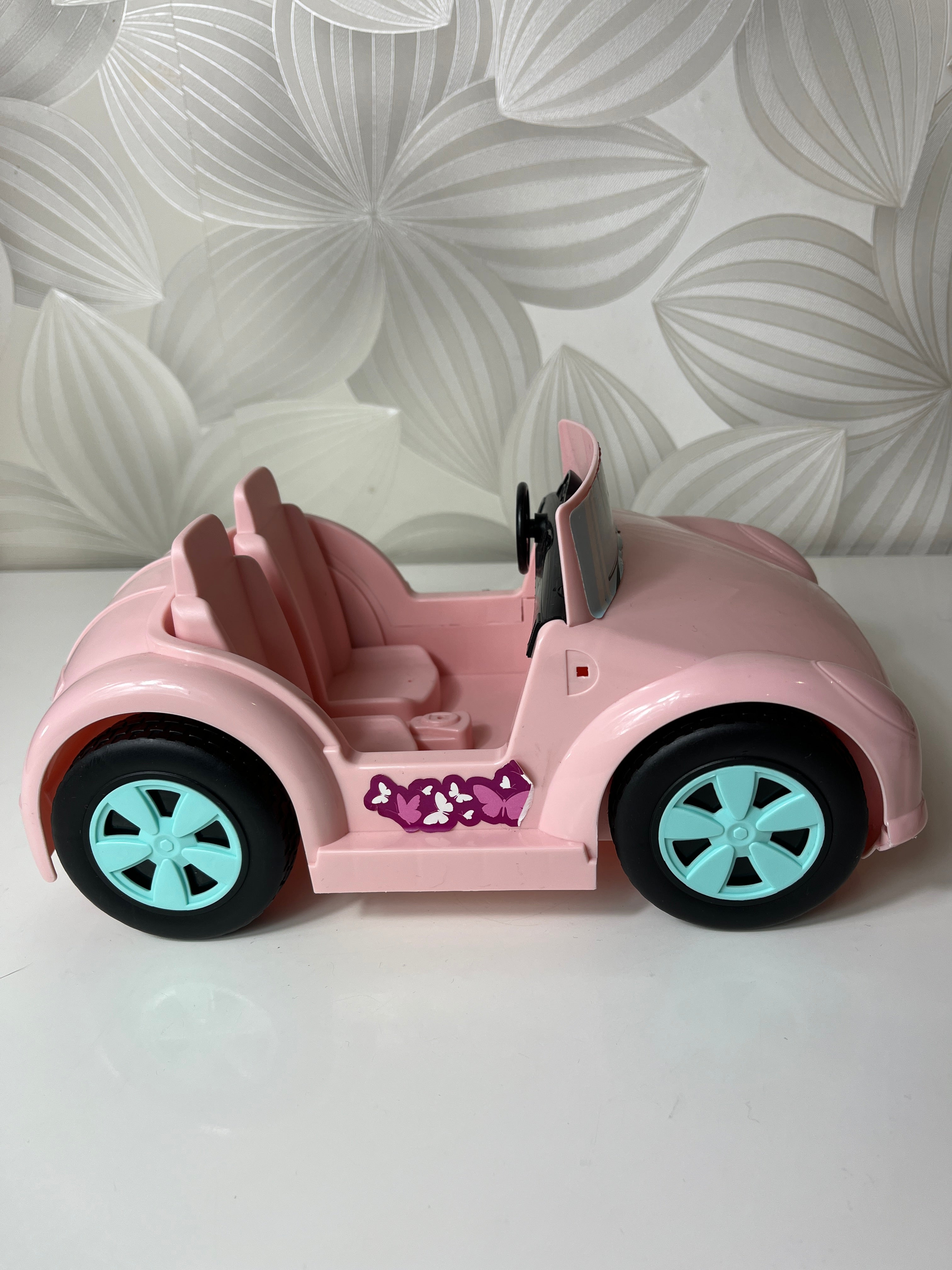 Rožinis žaislinis lėlių automobilis-kabrioletas