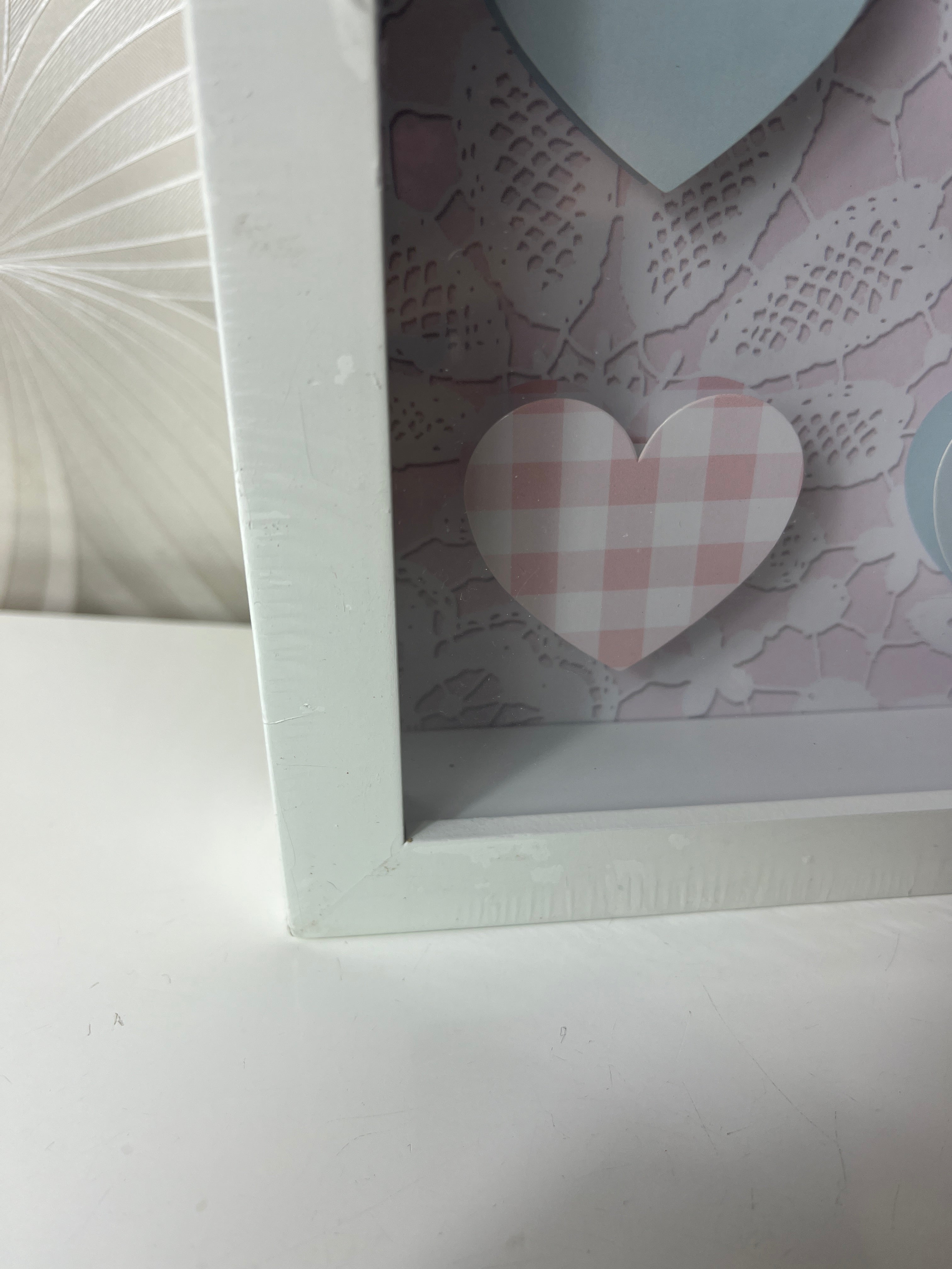 Dekoratyvinė širdelių rėmelio kompozicija