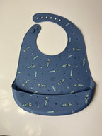 Mėlynas silikoninis seilinukas vaikui su raketomis - Daiktų atokvėpis