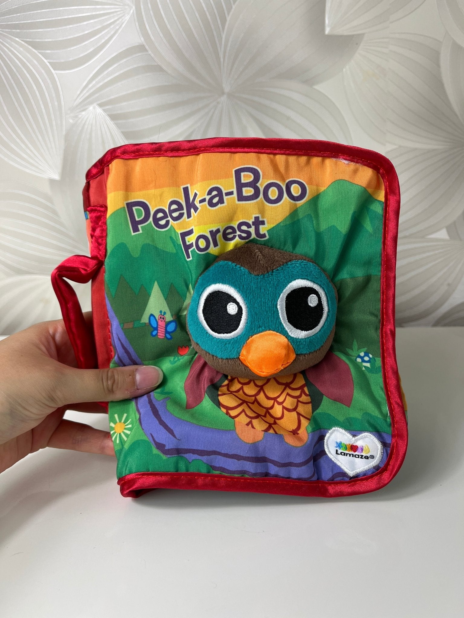 Minkšta knygelė „Peek - a - Boo Forest“ (Lamaze) - Daiktų atokvėpis