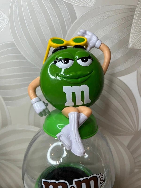 Žalias M&M's saldainių dispenseris (2008 m.) - Daiktų atokvėpis