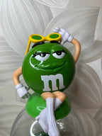 Žalias M&M's saldainių dispenseris (2008 m.) - Daiktų atokvėpis