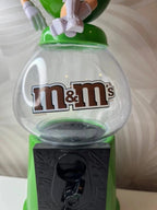 Žalias M&M's saldainių dispenseris (2008 m.) - Daiktų atokvėpis
